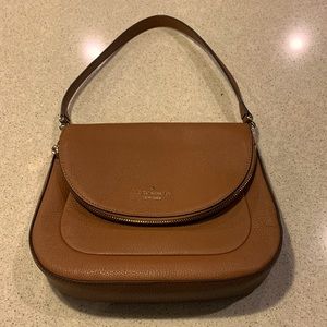 Kate Spade camel colored purse with front zippered flap.